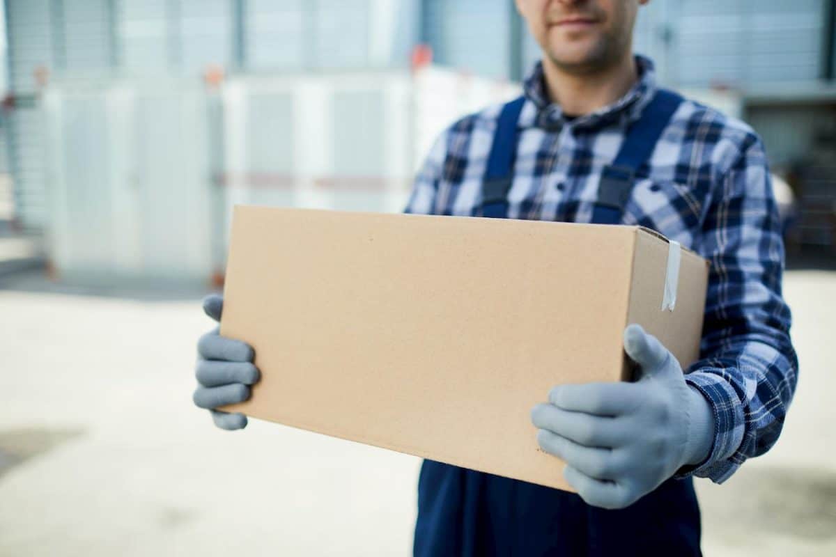 photo of a mover holding a box