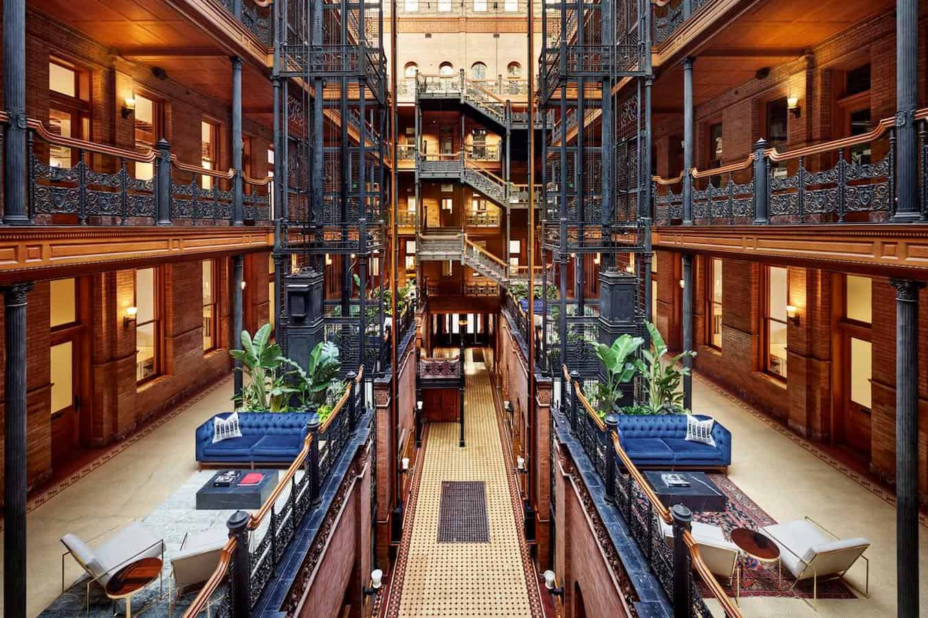 a building with iron rails and beautiful interior Bradbury building in downtown la things to do in downtown la visiting los angeles public library rooftop bar los angeles concert hall